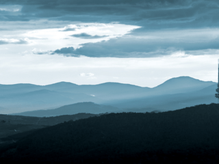 Landscape of photo of Canberra featuring hills and Telstra tower
