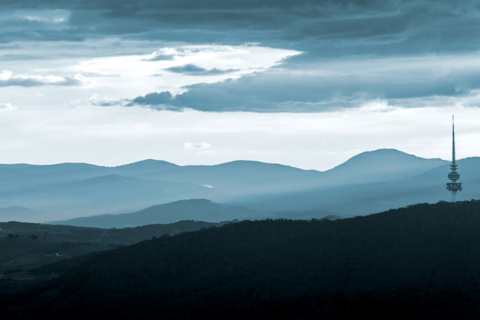 Landscape of photo of Canberra featuring hills and Telstra tower